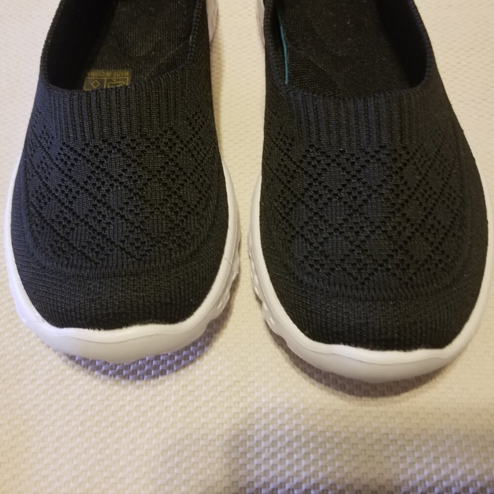 sweater styled fabric exterior, black slip-on shoes